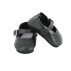 Chaussures à bride coloris noir pour poupée MINOUCHE taille 34 cm